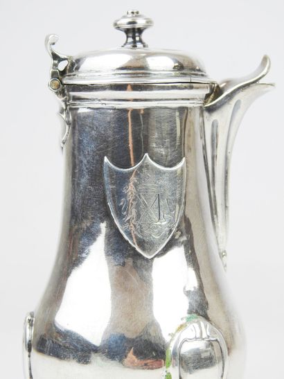 Silver tripod selfish jug decorated with...