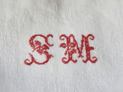 Nine large towels with S.M. in red.