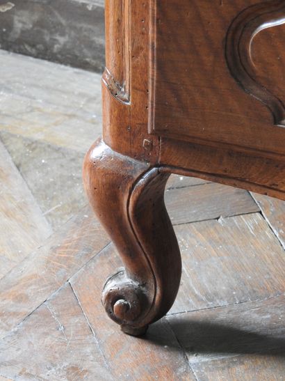 Walnut chest of drawers, molded and carved,...