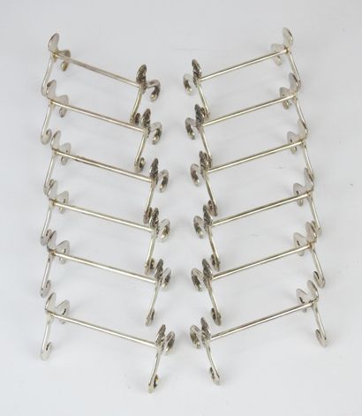 Series of twelve silver plated knife holders...