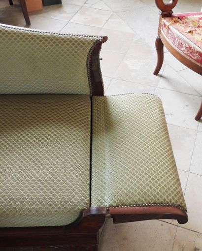 Large mahogany sofa, the ribbed armrests...