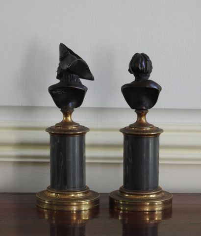 Pair of bronze busts with brown patina representing...