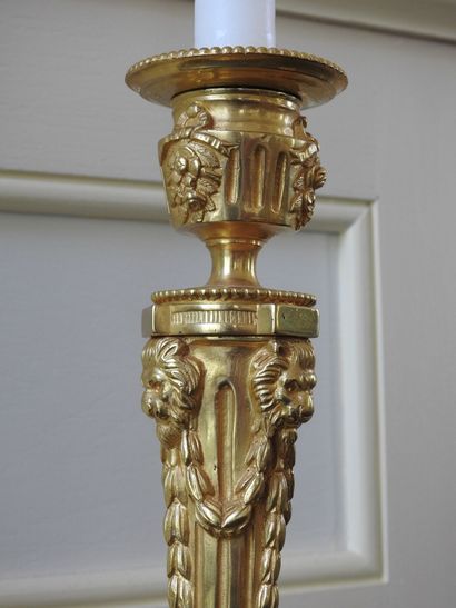 Pair of ormolu torches decorated with garlands...