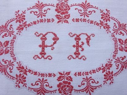 Twelve large napkins with red decoration...