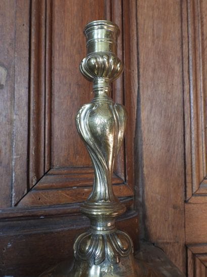 Pair of bronze torches with rocaille decoration....