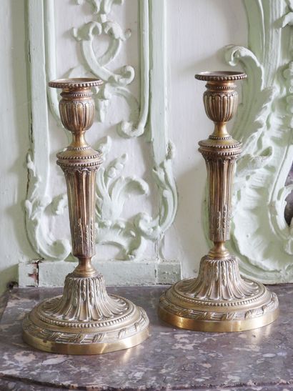 Pair of Louis XVI style gilt bronze fluted...