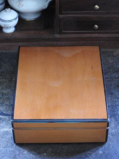 Cigar cabinet in blond wood and ebony nets...