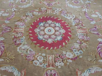 Large Aubusson carpet, the brown field decorated...