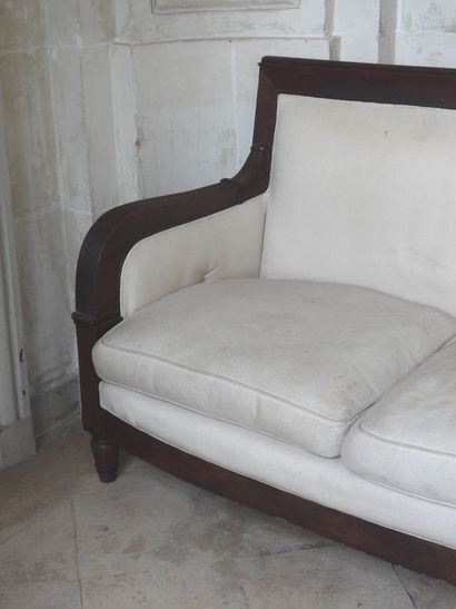 Large mahogany sofa, the ribbed armrests...