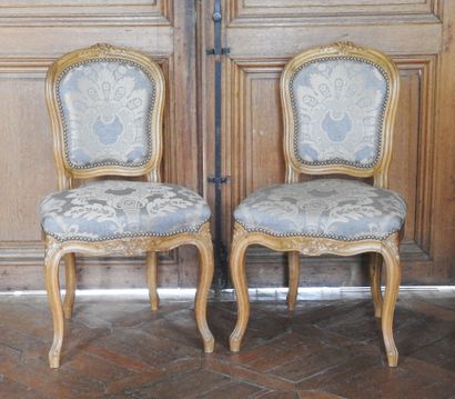 Pair of chairs in natural wood, molded and...