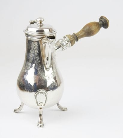 Selfish tripod silver jug decorated with...