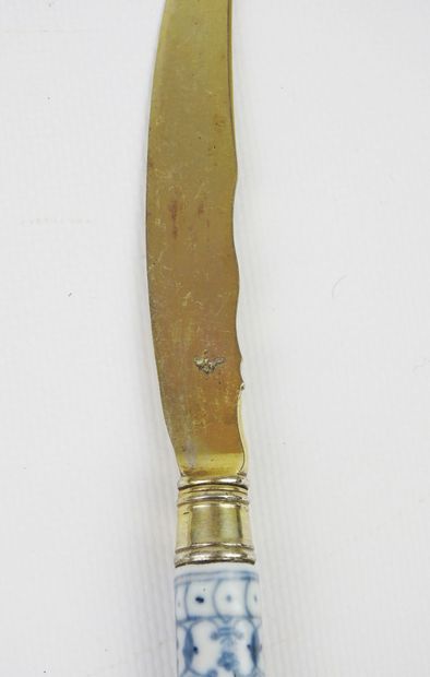 Set of three knives and two forks with two...