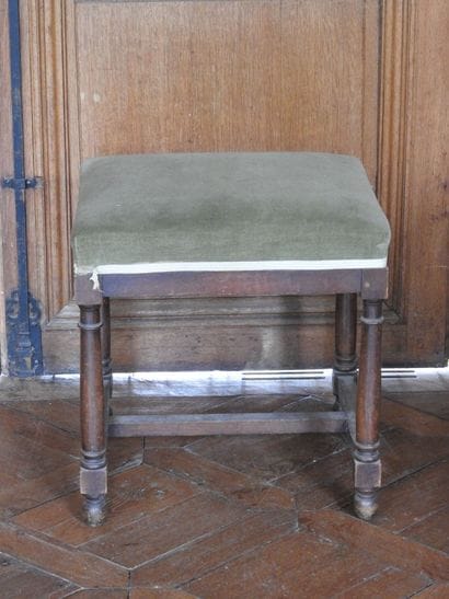 Walnut stool with four baluster feet joined...