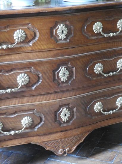 Walnut chest of drawers, molded and carved,...