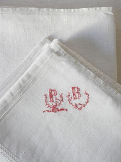 Eleven towels with P.B. in red.