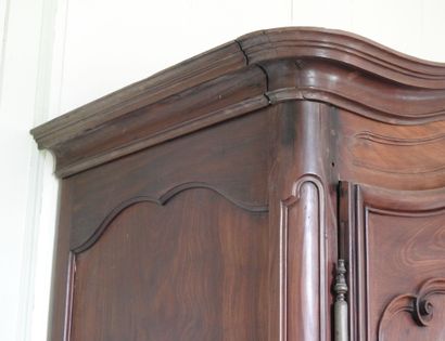 Mahogany cabinet molded and carved with cornice...