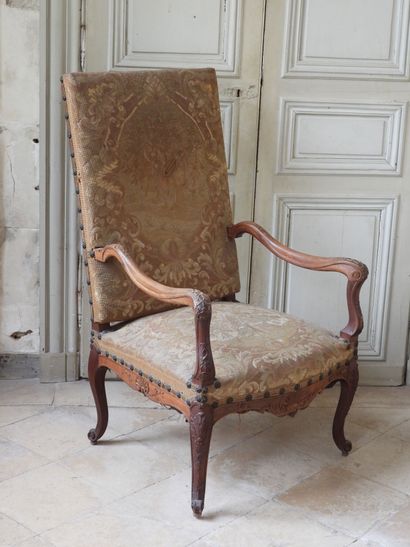 Regency style armchair in natural wood resting...