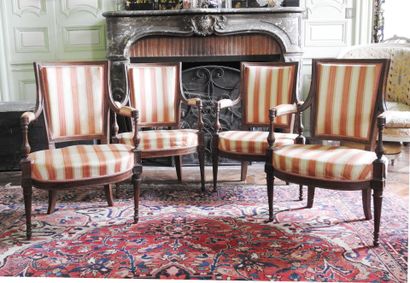 Suite of four armchairs in molded and carved...
