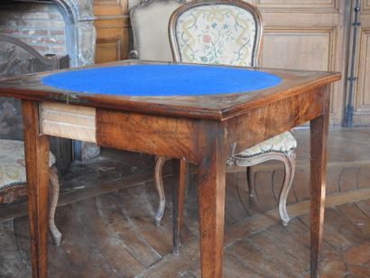 Mahogany and mahogany veneer game table resting...