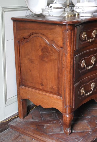 Walnut chest of drawers, molded and carved,...