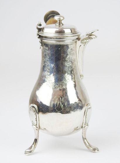 Selfish tripod silver jug decorated with...