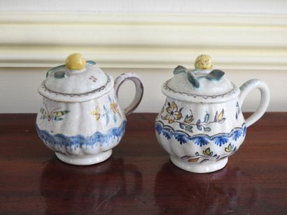 Meeting of two covered creamers in earthenware...