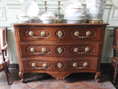 Walnut chest of drawers, molded and carved,...