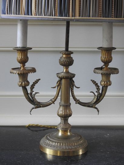 Pair of Louis XVI style candlesticks in chased...