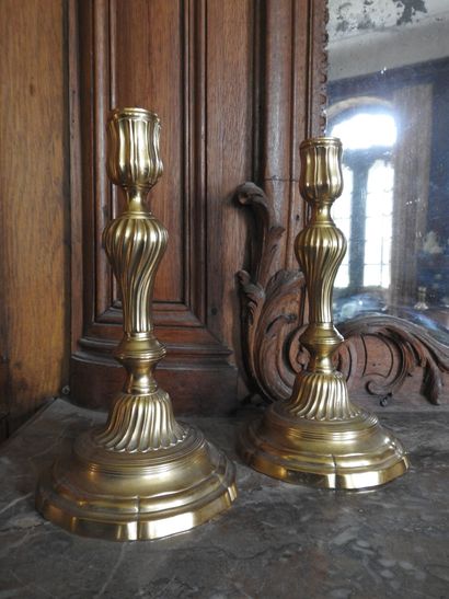 Pair of ormolu torches with torso shaft....