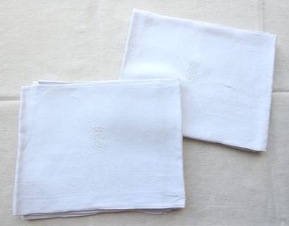 Seven damask napkins decorated with ears...