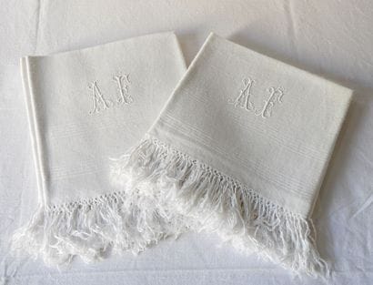 Six guest towels with A.F. Damask borders...
