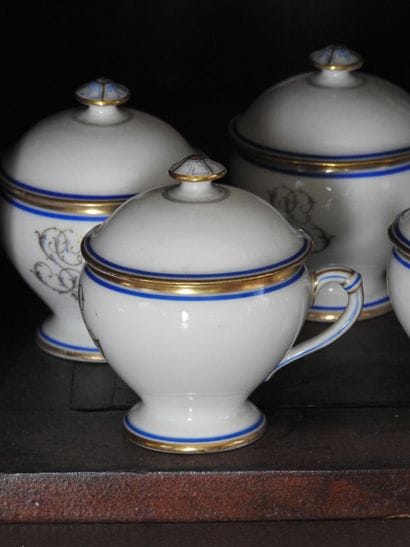 Suite of four creamers and a round sugar...