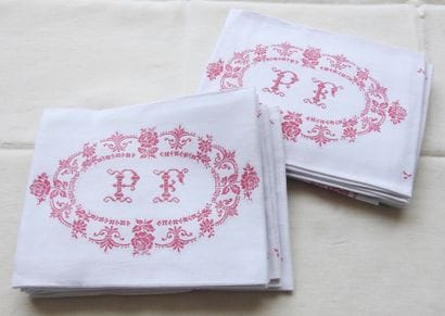 Twelve large napkins with red decoration...