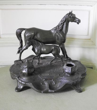 Inkwell in regula with brown patina representing...
