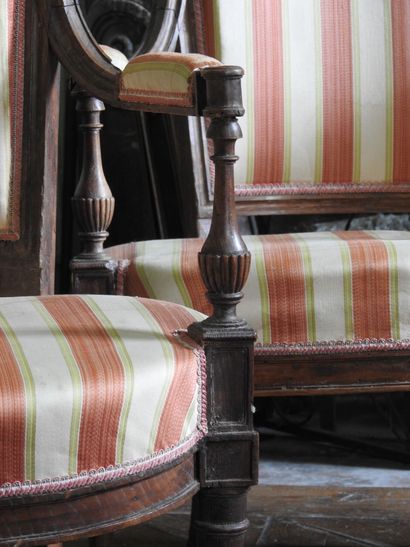Suite of four armchairs in molded and carved...