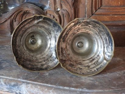 Pair of bronze torches with rocaille decoration....