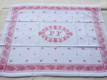 Twelve large napkins with red decoration...