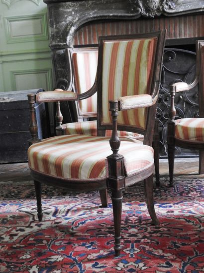 Suite of four armchairs in molded and carved...
