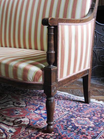 Sofa in molded and carved natural wood, baluster...