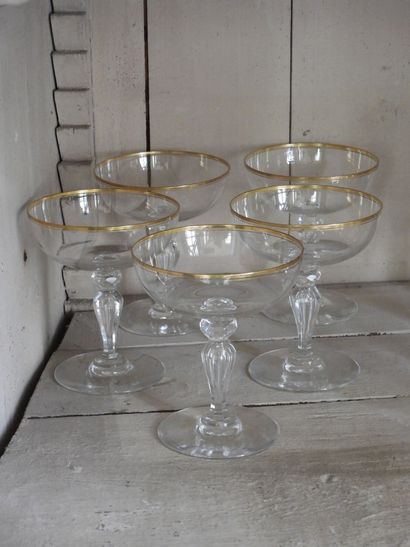 Suite of five crystal champagne glasses with...