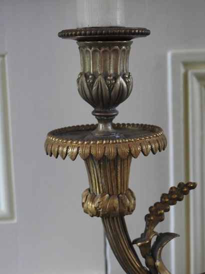 Pair of Louis XVI style candlesticks in chased...