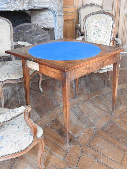 Mahogany and mahogany veneer game table resting...
