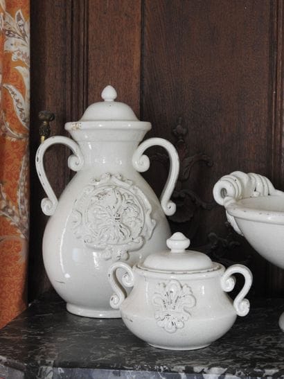 Set of cream colored cracked earthenware...