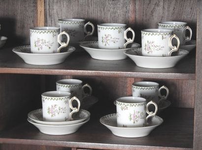 Suite of nine coffee cups in porcelain with...