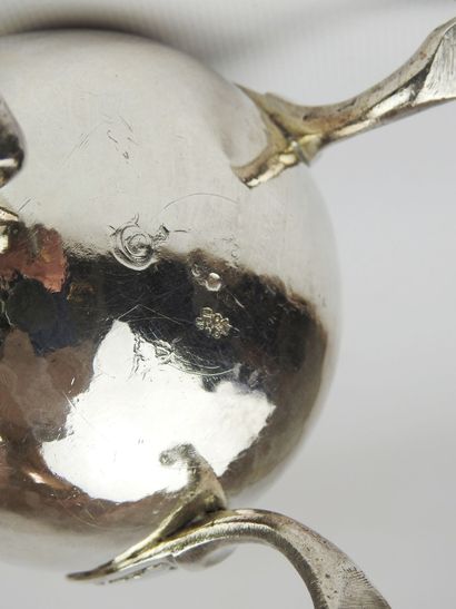 Selfish tripod silver jug decorated with...