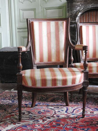 Suite of four armchairs in molded and carved...