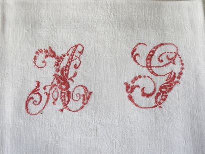 Nine large napkins with A.G. in red.