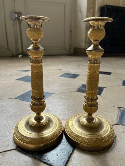 Pair of gilt bronze candlesticks with chased...