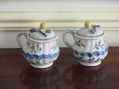 Meeting of two covered creamers in earthenware...