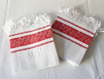 Six guest towels encrypted MF red border...